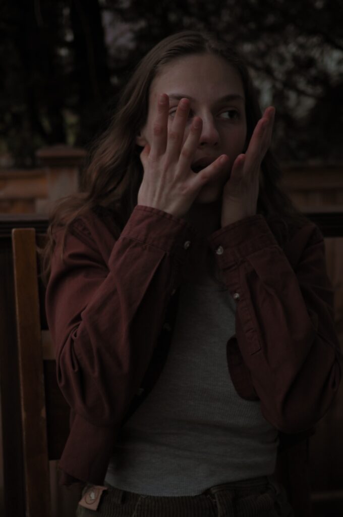 emily-saletan-folk-music-acoustic-songwriter-artist-hands-over-face